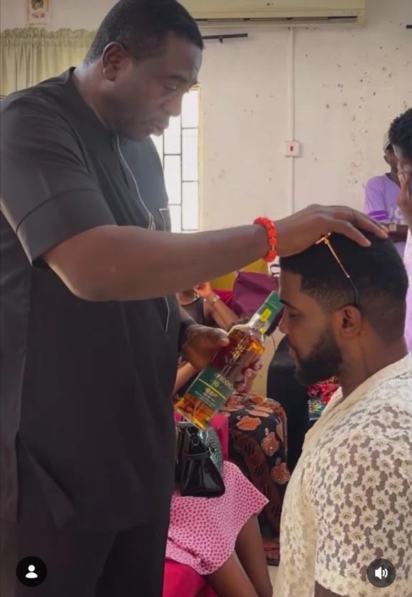 Reality TV Star Bright Morgan Kneels And Asks Nollywood Icon Bob Manuel Udokwu To Pray For Him.