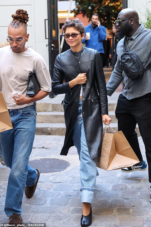 Zendaya enjoys Paris shopping spree in divisive £1,000 shoes and £2,000 Prada coat after sparking criticism for ‘lacking basic manners’ at PFW show