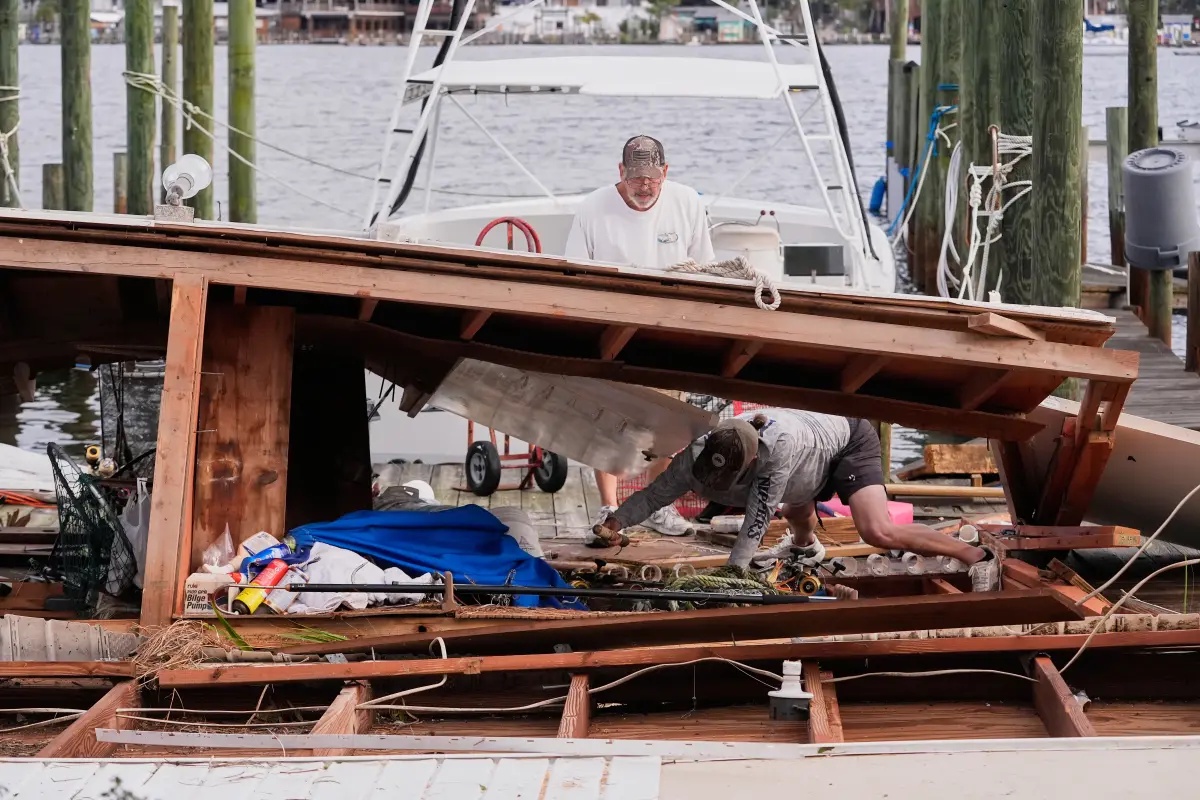 Isaias weakens, but flooding threat and outages persist