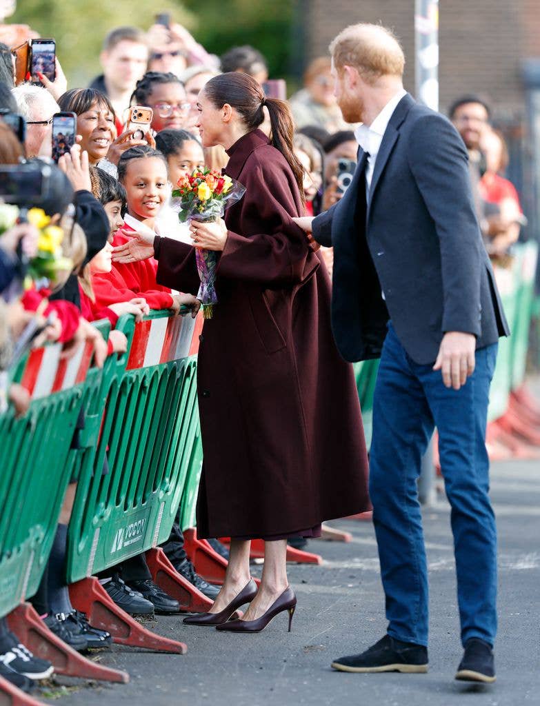 Prince Harry rushes chatty Meghan Markle as she gets carried away on walkabout: ‘We’ve got to go’ – watch