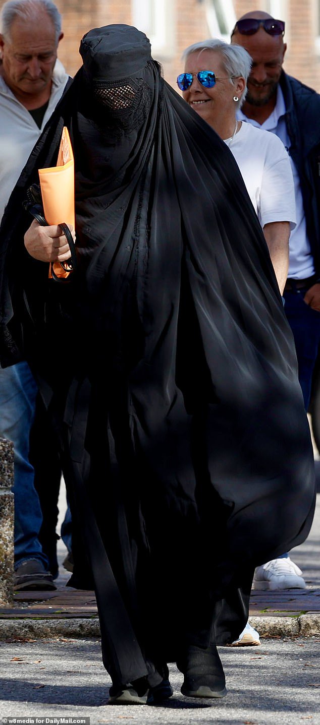 Anti-migrant protester arrives at court in burqa after he was charged with  breaching face-covering ban by wearing full Islamic dress to Portsmouth demo