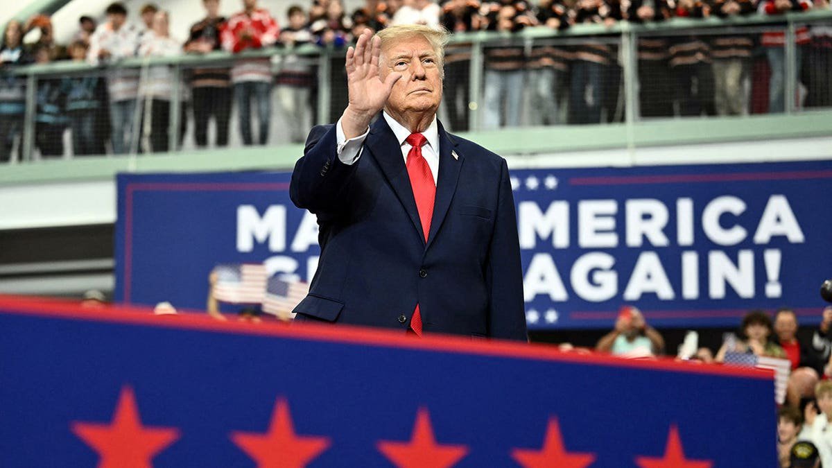 Trump signs pardons for Alaska diesel mechanics onstage during rally touting major energy deals