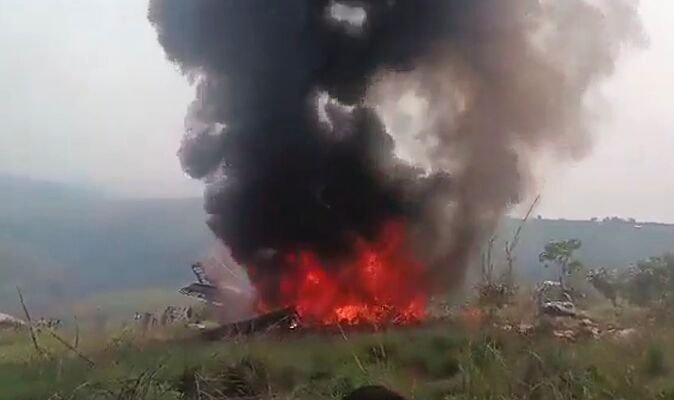Horror as 13 killed after military plane crashes near houses and bursts into flames
