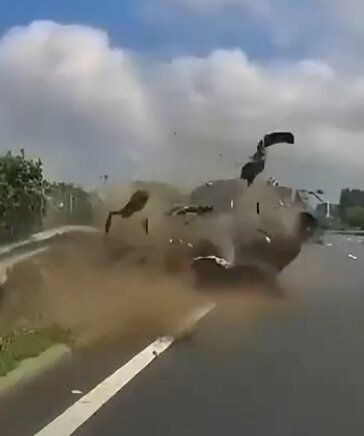 Horrifying moment mum & child violently thrown from car as driver slams into guardrail at high speed after swerving