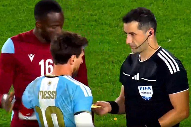 Bizarre moment Lionel Messi is handed a surprising gift by referee at the end of his emotional Argentina farewell